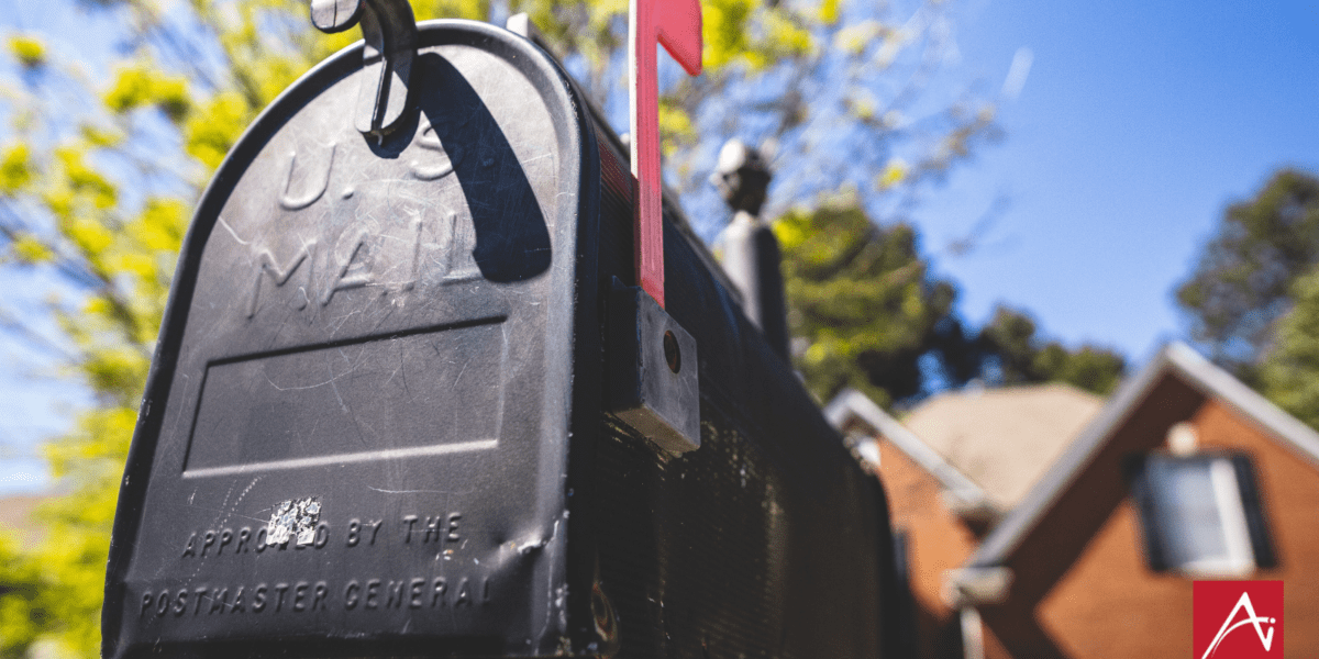 black mailbox with red flag up