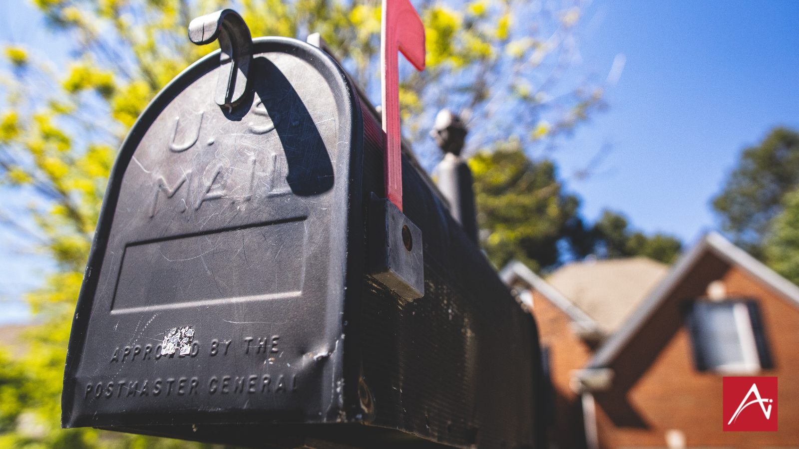 black mailbox with red flag up