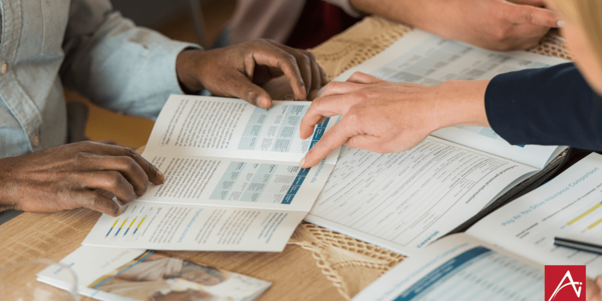 adults looking at brochures