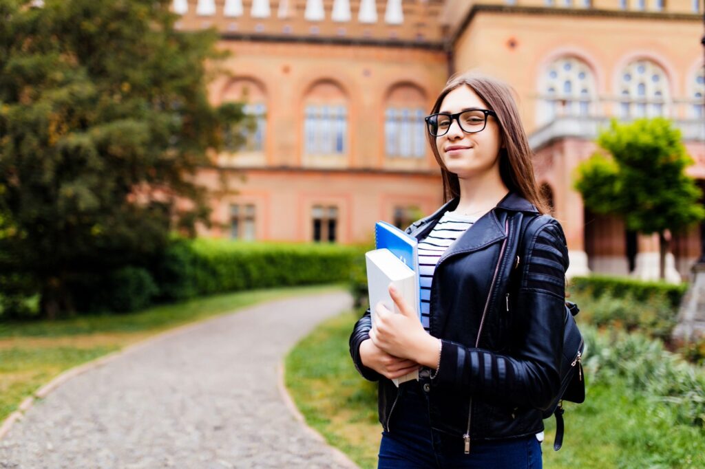 College Student Holding Books