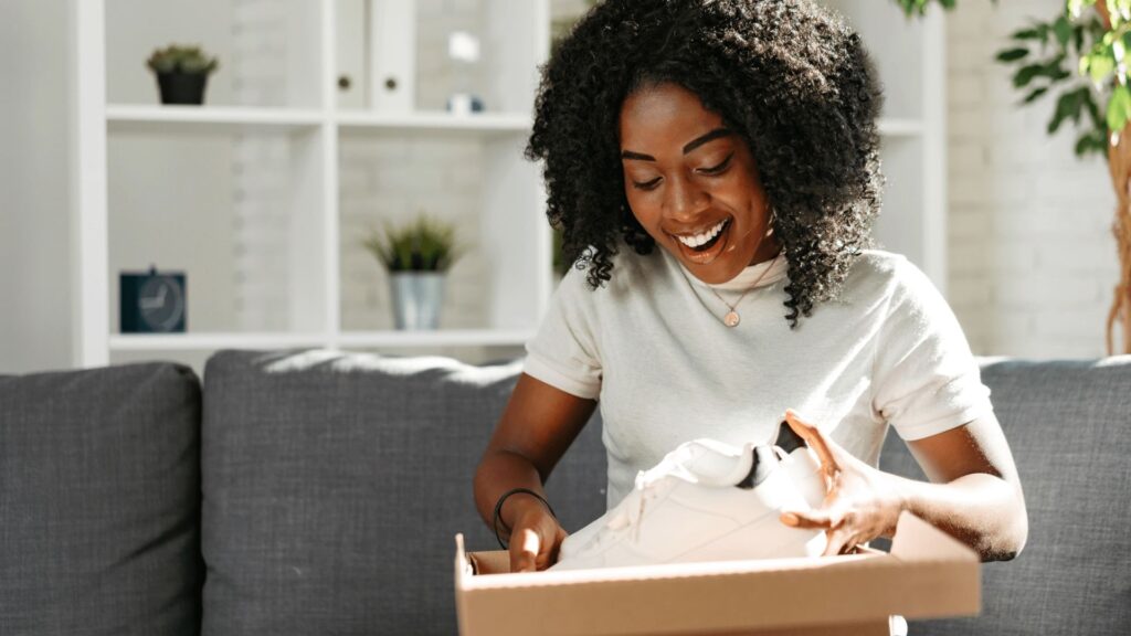 Woman unboxing new shoes
