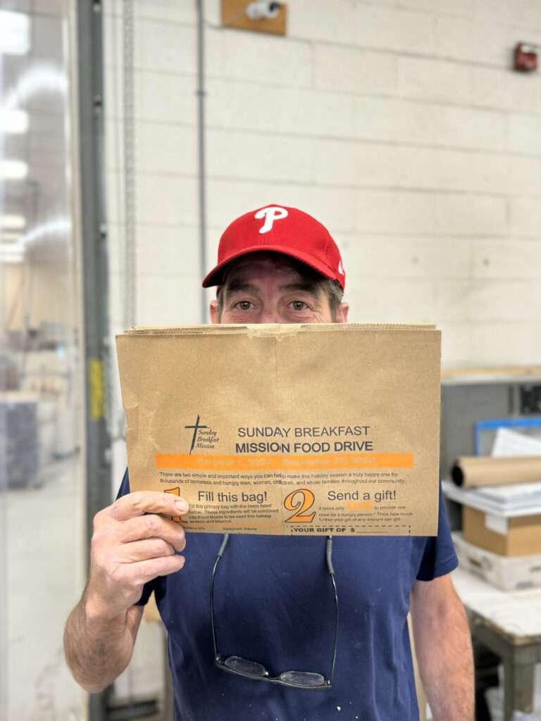 Dave holding the last folded bag of 100K